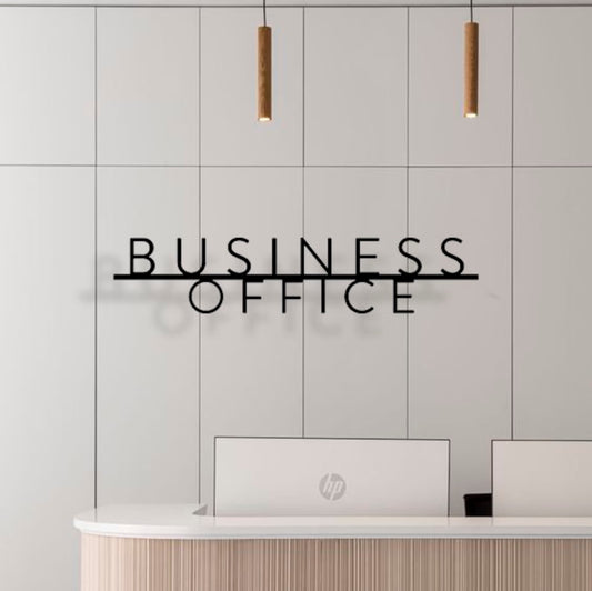 Custom metal sign displaying text in a sleek, modern font. Floating metal letters mounted on a light-colored textured background. Minimalist design suitable for home or business decor.